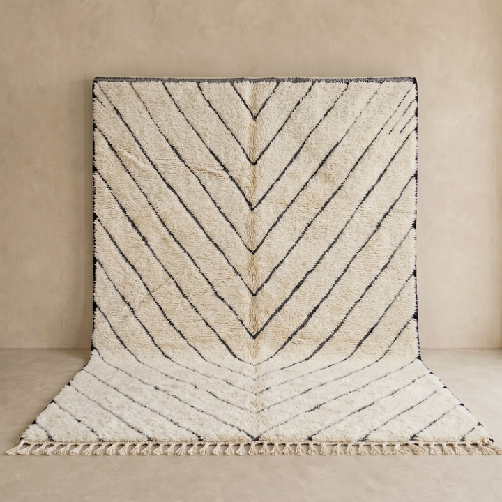 Modern Moroccan Beni Ourain wool rug with black chevron lines on cream background, handmade by Berber artisans