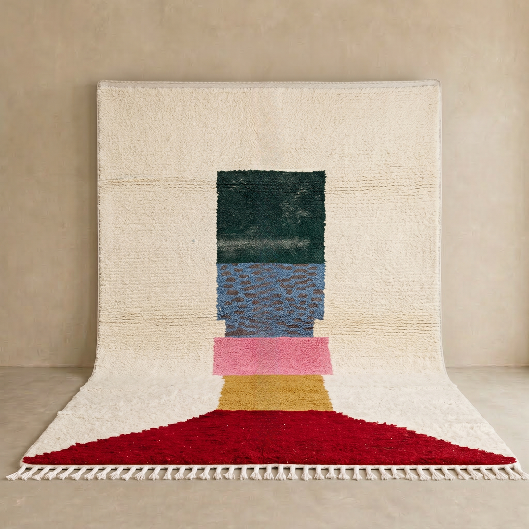 Modern Moroccan wool rug with ivory background and color blocks in green, blue, pink, mustard, and red
