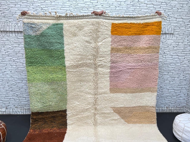 Modern color block Moroccan wool rug with green, pink, brown, and white geometric pattern