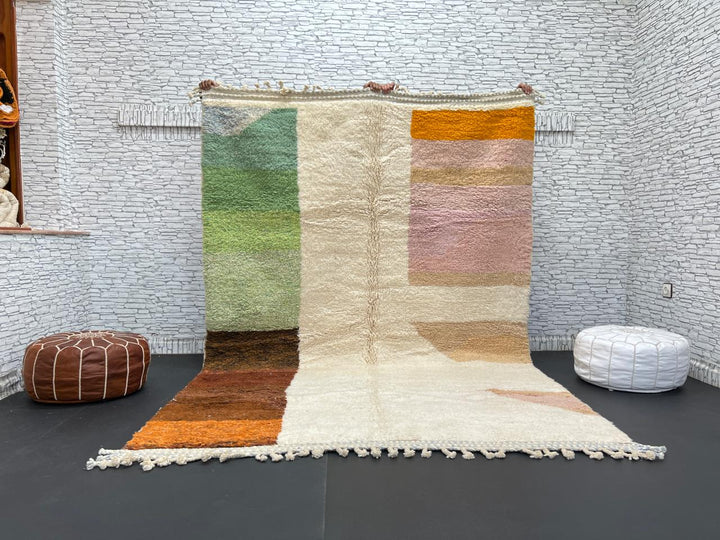 Modern color block Moroccan wool rug with green, pink, brown, and white geometric pattern
