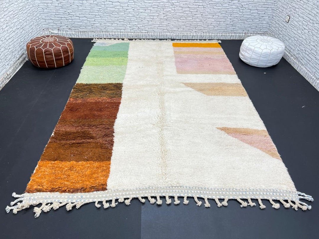Modern color block Moroccan wool rug with green, pink, brown, and white geometric pattern