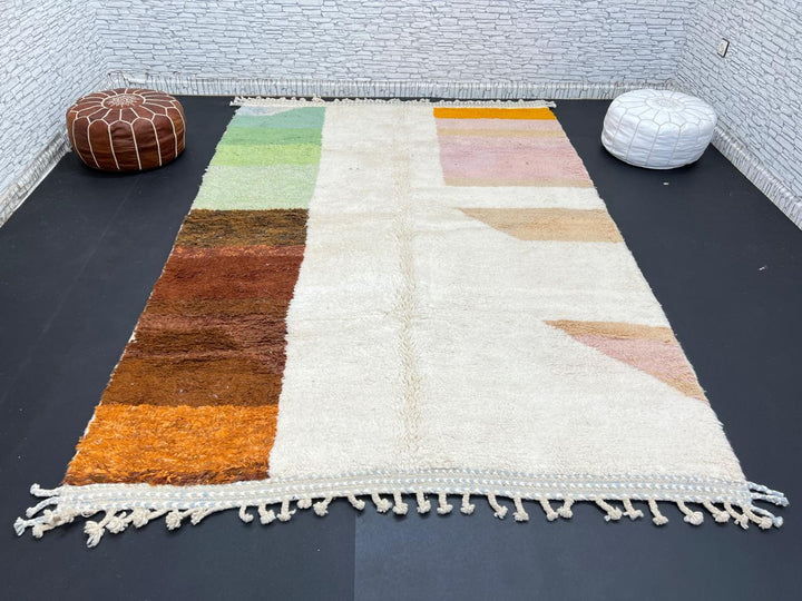 Modern color block Moroccan wool rug with green, pink, brown, and white geometric pattern