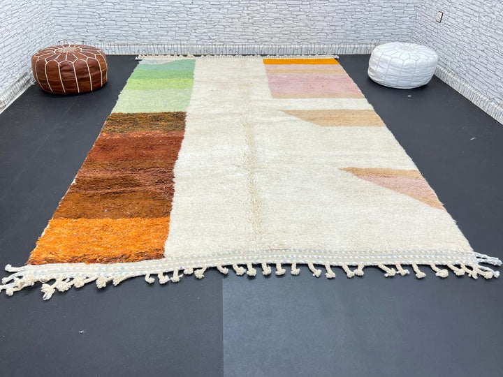 Modern color block Moroccan wool rug with green, pink, brown, and white geometric pattern