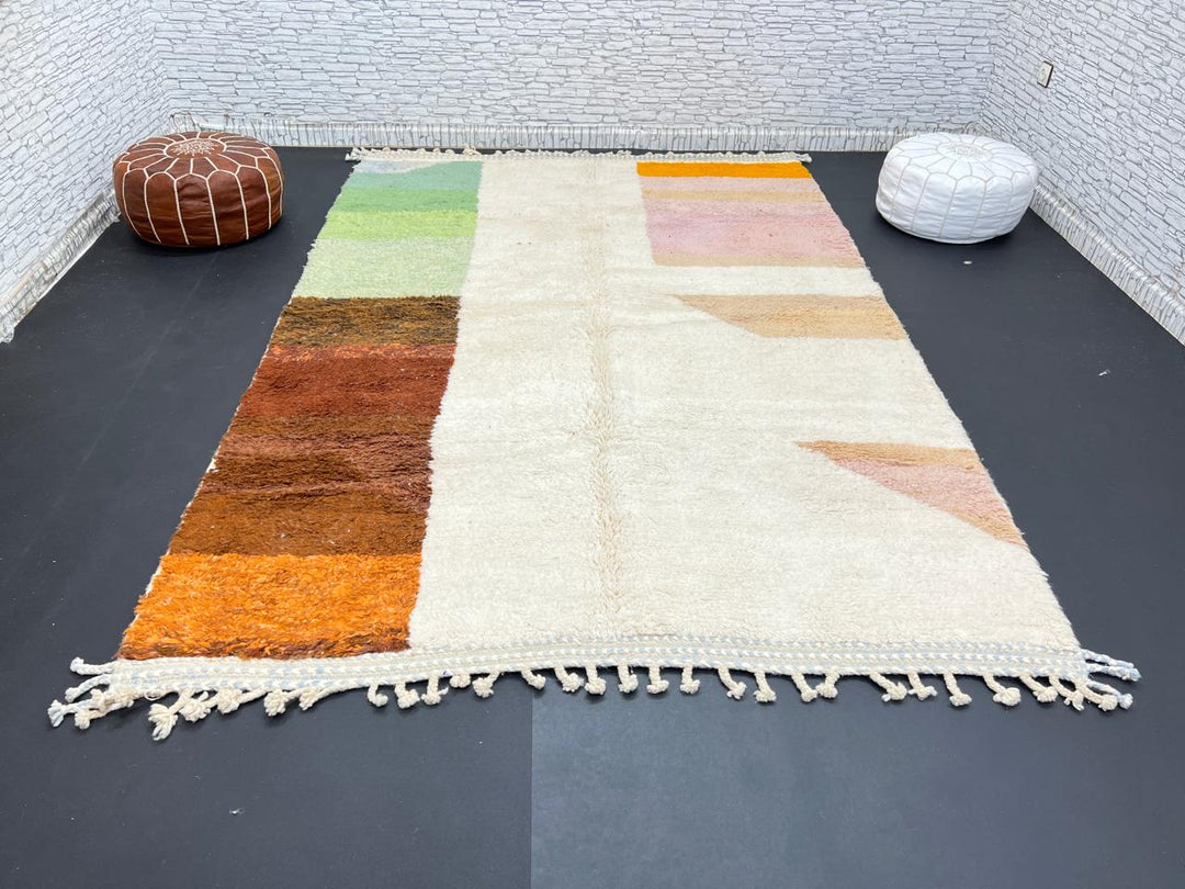 Modern color block Moroccan wool rug with green, pink, brown, and white geometric pattern