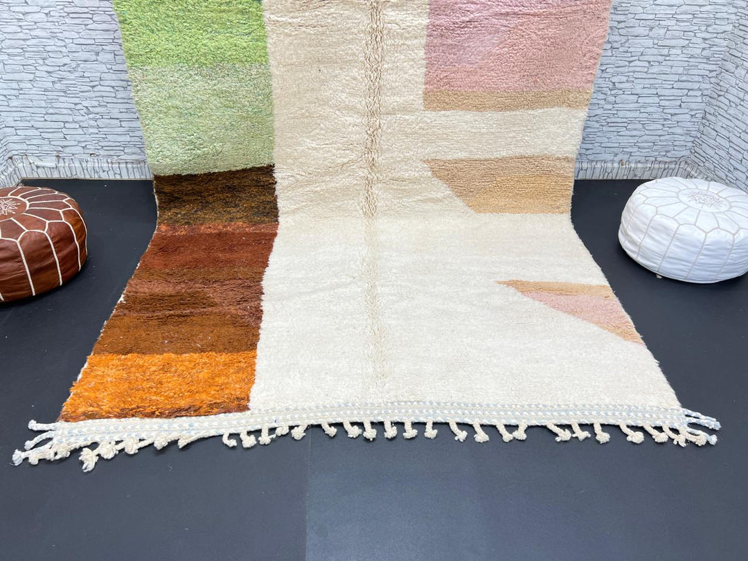 Modern color block Moroccan wool rug with green, pink, brown, and white geometric pattern