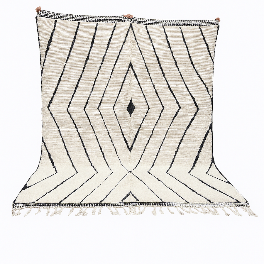 Handwoven Moroccan wool rug with black geometric diamond line pattern