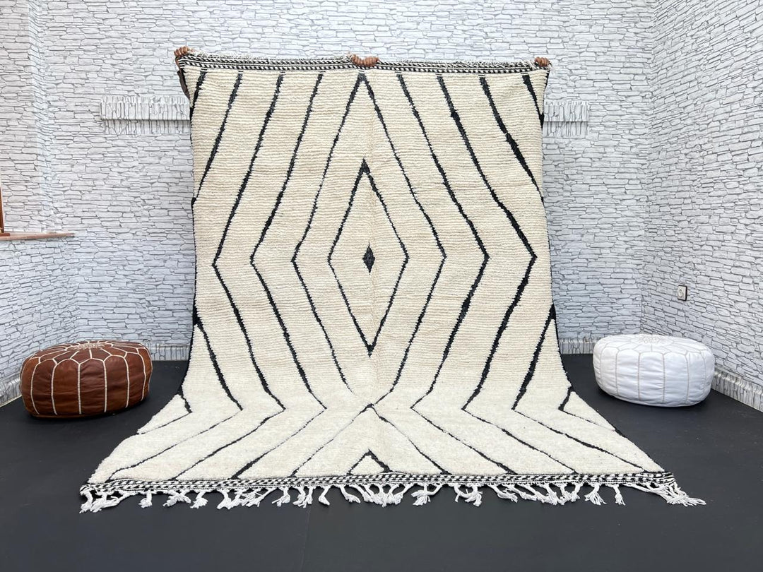 Handwoven Moroccan wool rug with black geometric diamond line pattern