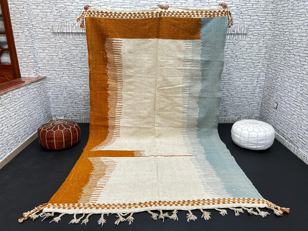 Flatweave Moroccan wool rug in beige, blue, and terracotta color blocks, handmade by Berber artisans