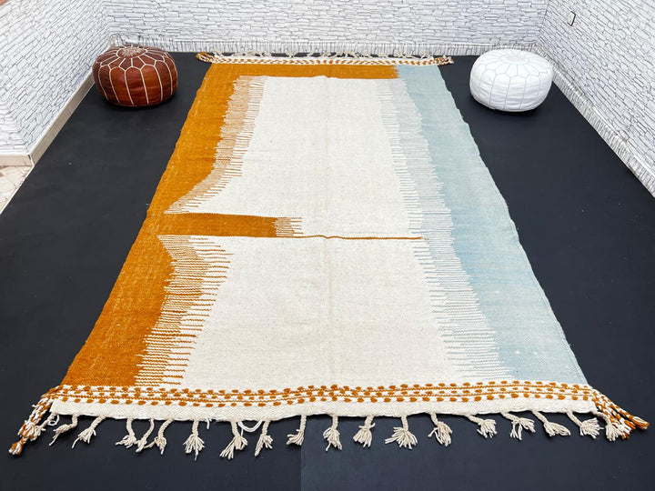 Flatweave Moroccan wool rug in beige, blue, and terracotta color blocks, handmade by Berber artisans