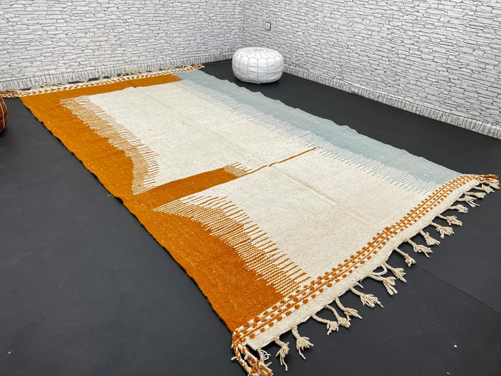 Flatweave Moroccan wool rug in beige, blue, and terracotta color blocks, handmade by Berber artisans