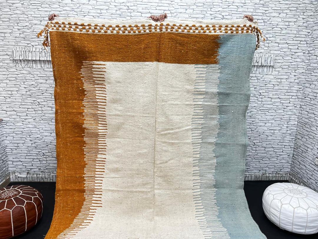 Flatweave Moroccan wool rug in beige, blue, and terracotta color blocks, handmade by Berber artisans