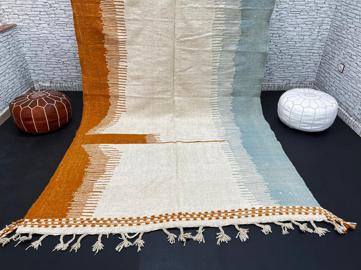 Flatweave Moroccan wool rug in beige, blue, and terracotta color blocks, handmade by Berber artisans