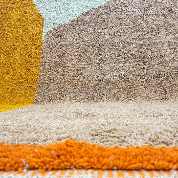 Handmade Moroccan wool rug with minimalist earth-tone design. Soft plush texture, modern style, and ethically crafted in Morocco.