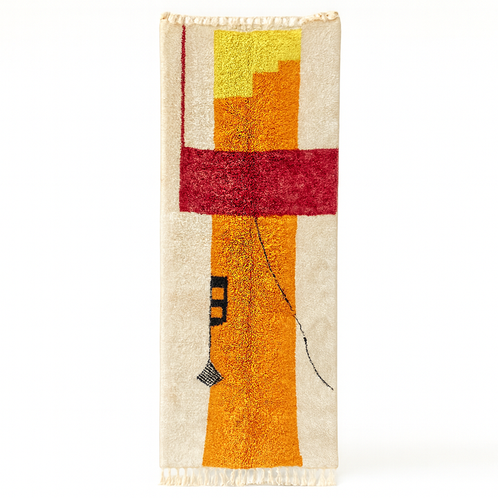 Handmade modern Moroccan wool runner rug with abstract red, orange, and yellow geometric design on a cream background