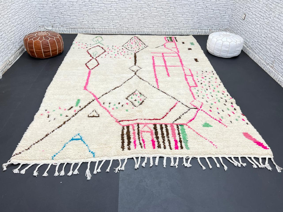 Modern Moroccan Berber wool rug with colorful geometric patterns on a cream background