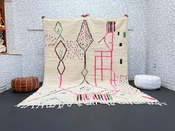 Modern Moroccan Berber wool rug with colorful geometric patterns on a cream background