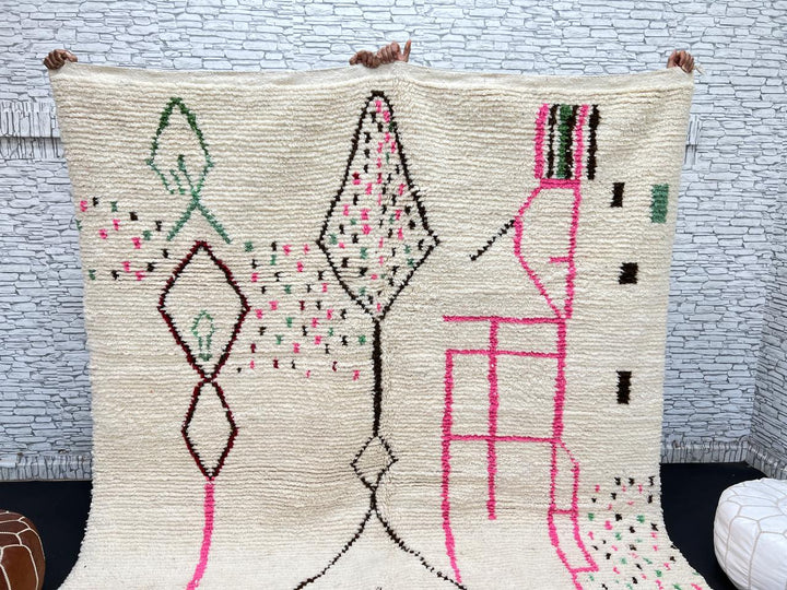 Modern Moroccan Berber wool rug with colorful geometric patterns on a cream background