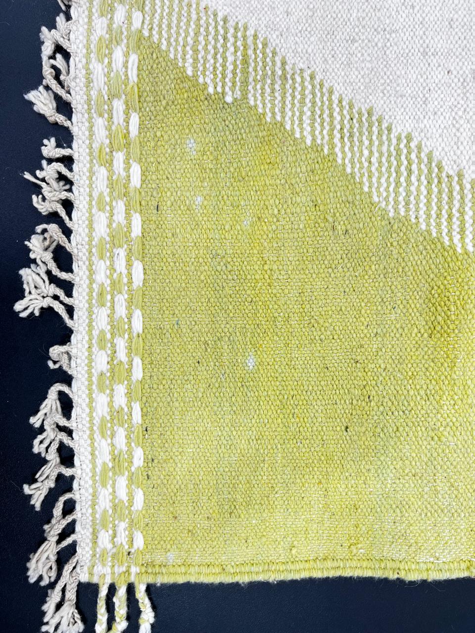 Handwoven Moroccan kilim runner rug with modern red and yellow abstract geometric design on a cream flatweave wool base.