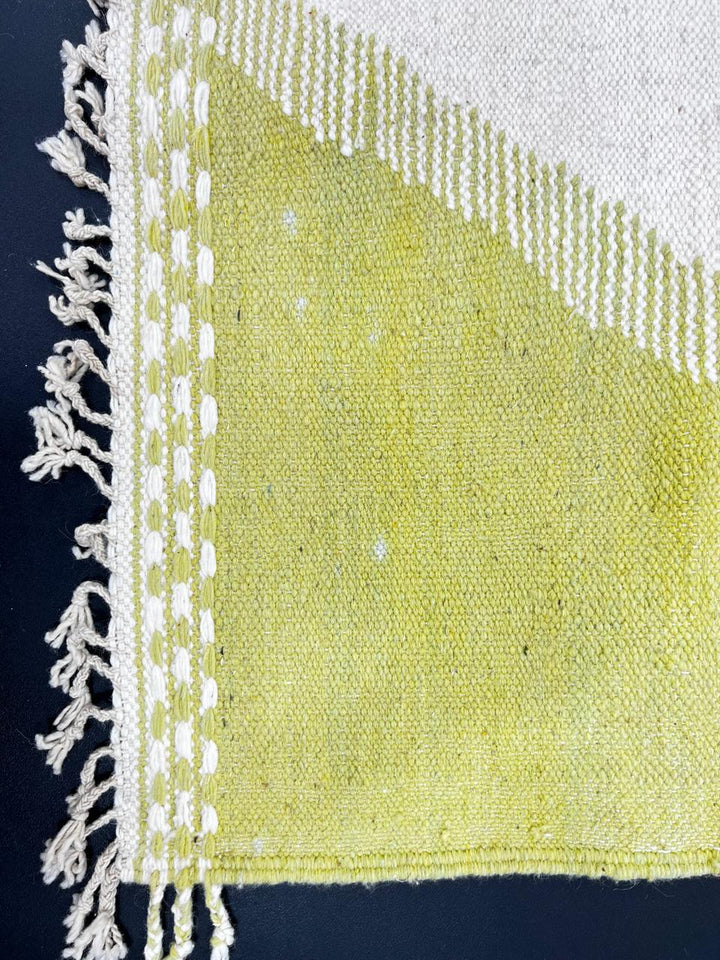 Handwoven Moroccan kilim runner rug with modern red and yellow abstract geometric design on a cream flatweave wool base.