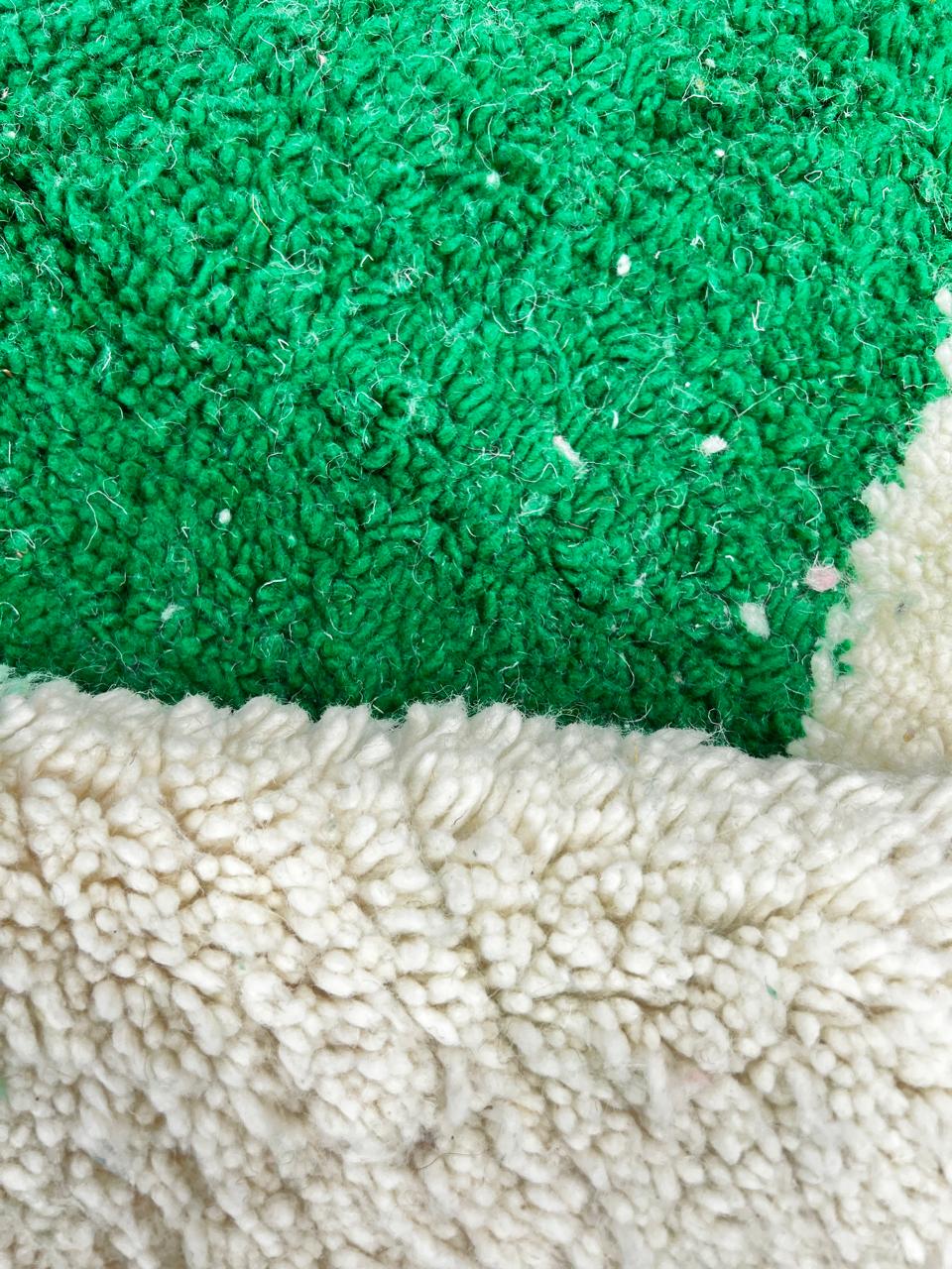 Handmade modern Moroccan round rug in pink and green geometric design, wool berber carpet