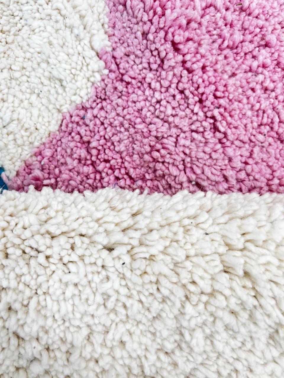 Handmade modern Moroccan runner rug with abstract orange, pink, and black geometric shapes on a white wool base