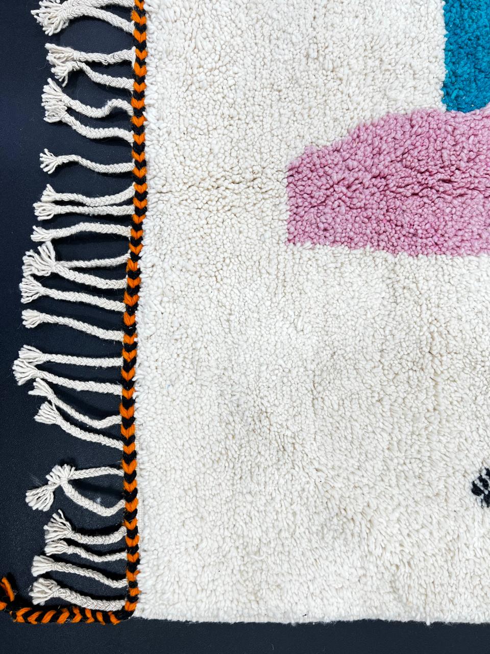 Handmade modern Moroccan runner rug with abstract orange, pink, and black geometric shapes on a white wool base