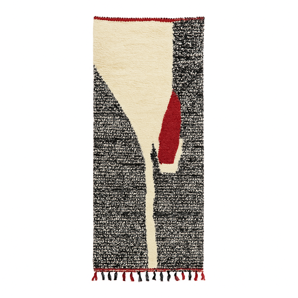 Handmade modern Moroccan runner rug with black, white, and red abstract design, crafted from natural wool by Berber artisans.