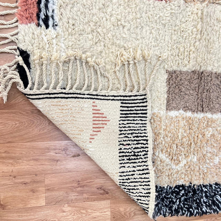 modern moroccan wool rug with abstract earth tone geometric design