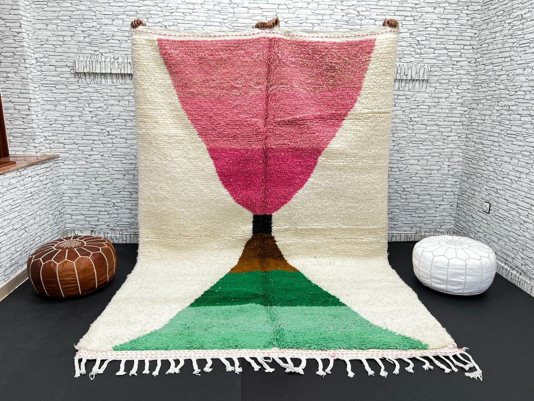 Modern Moroccan wool rug with pink and green hourglass geometric design, handmade by Berber artisans