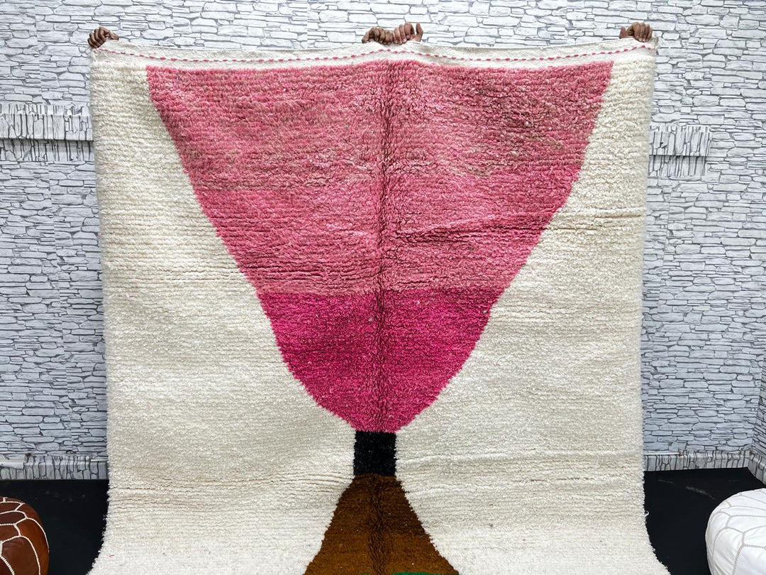 Modern Moroccan wool rug with pink and green hourglass geometric design, handmade by Berber artisans