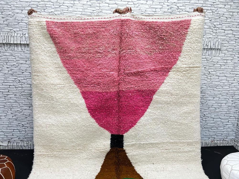 Modern Moroccan wool rug with pink and green hourglass geometric design, handmade by Berber artisans
