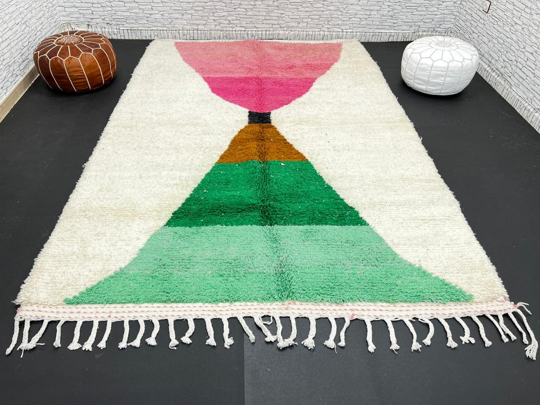 Modern Moroccan wool rug with pink and green hourglass geometric design, handmade by Berber artisans