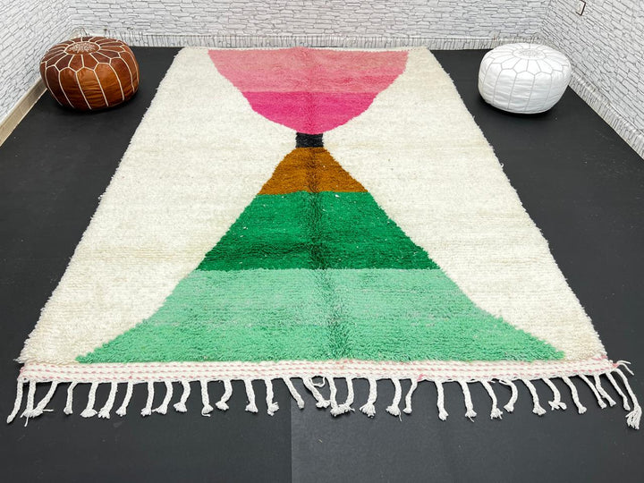 Modern Moroccan wool rug with pink and green hourglass geometric design, handmade by Berber artisans