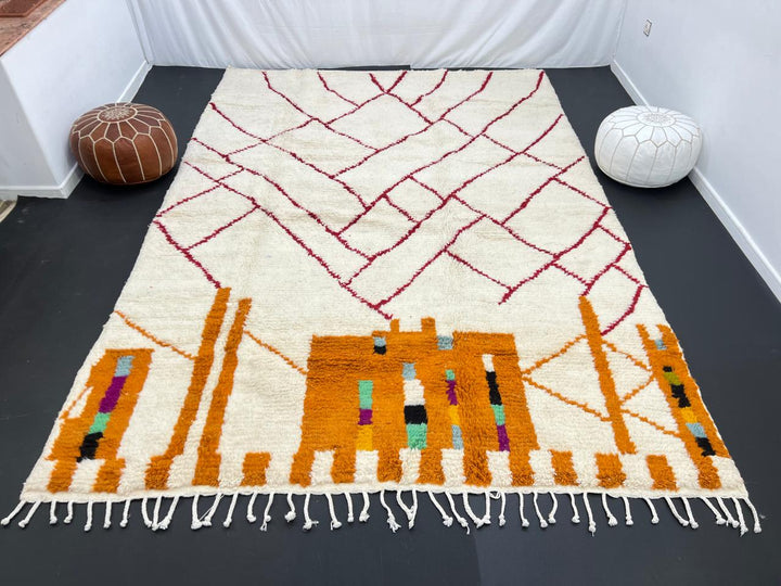 Modern Moroccan wool rug with abstract burgundy lines and golden geometric pattern on a white background