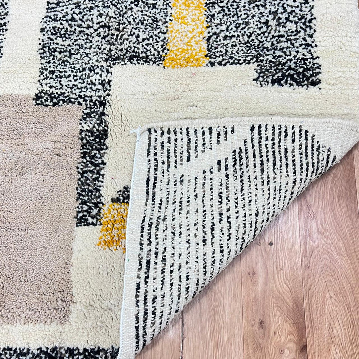 Modern Moroccan wool runner rug with abstract geometric design in mustard yellow, terracotta, beige and black, handmade Berber carpet
