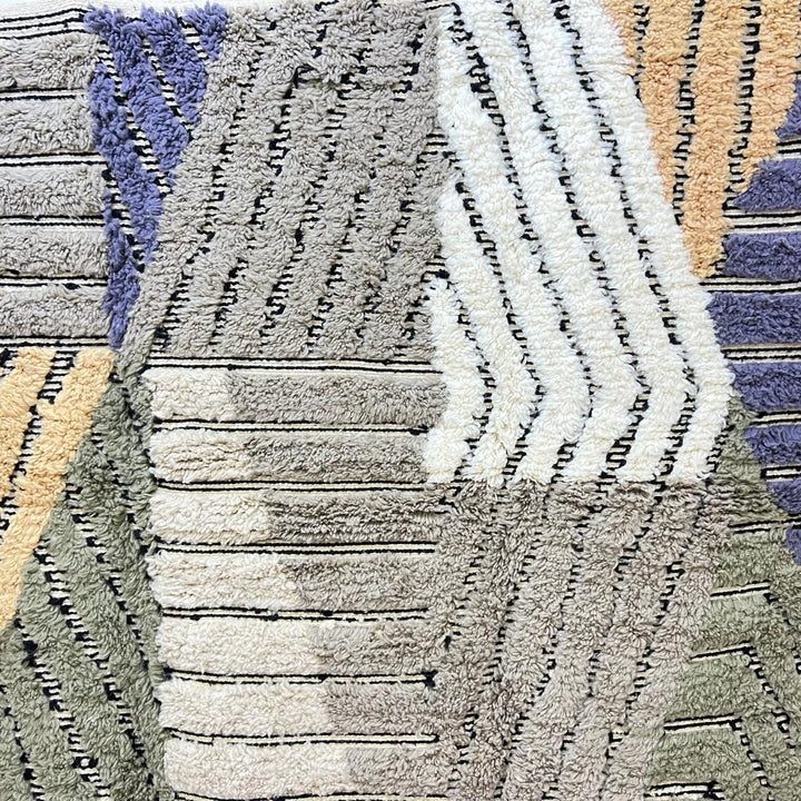 Modern Moroccan wool runner rug with carved black lines, abstract geometric design in ivory, beige, green and grey, handmade Berber carpet