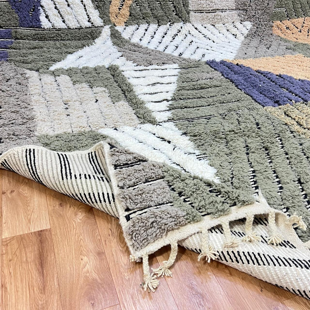 Modern Moroccan wool runner rug with carved black lines, abstract geometric design in ivory, beige, green and grey, handmade Berber carpet