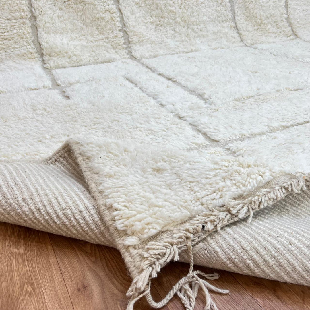 Modern Moroccan wool runner rug with geometric Berber pattern in ivory