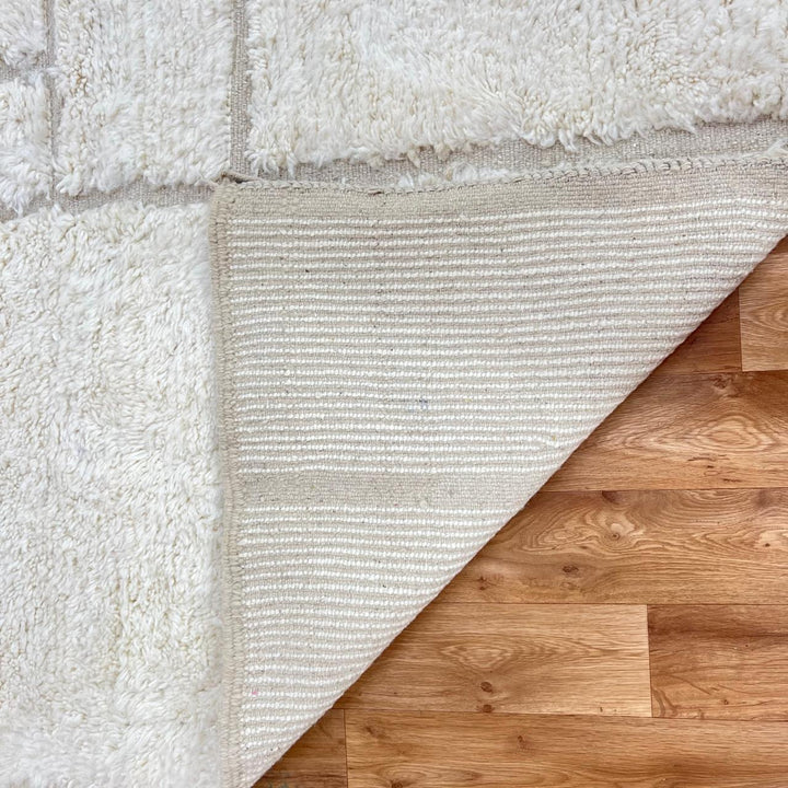 Modern Moroccan wool runner rug with geometric Berber pattern in ivory