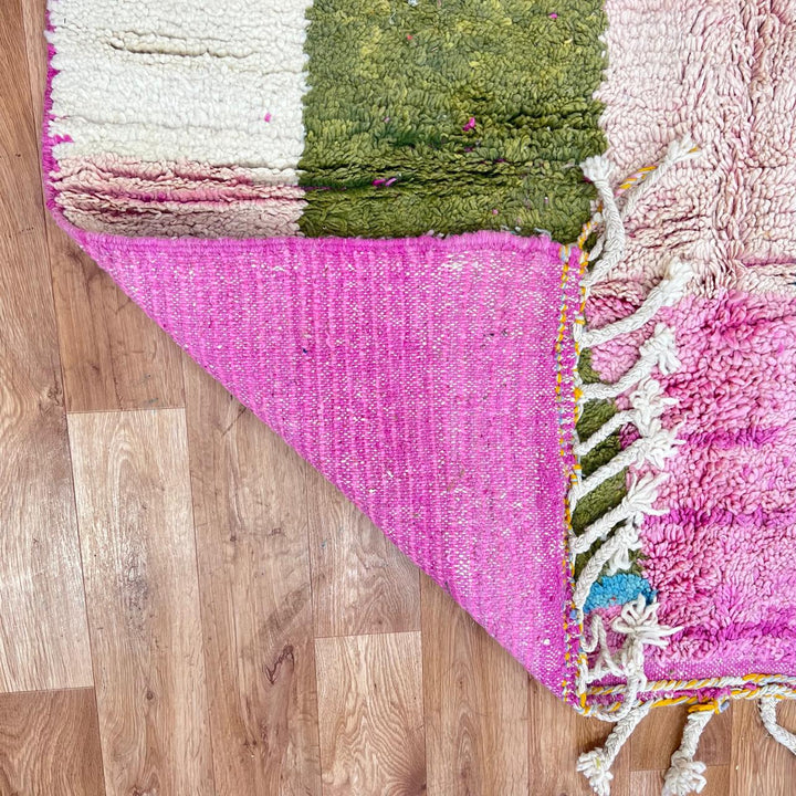 Vintage Moroccan wool rug with soft pastel geometric color-block design in ivory, pink, green, and mustard tones, handwoven by Berber artisans