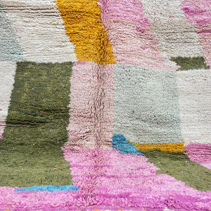 Vintage Moroccan wool rug with soft pastel geometric color-block design in ivory, pink, green, and mustard tones, handwoven by Berber artisans