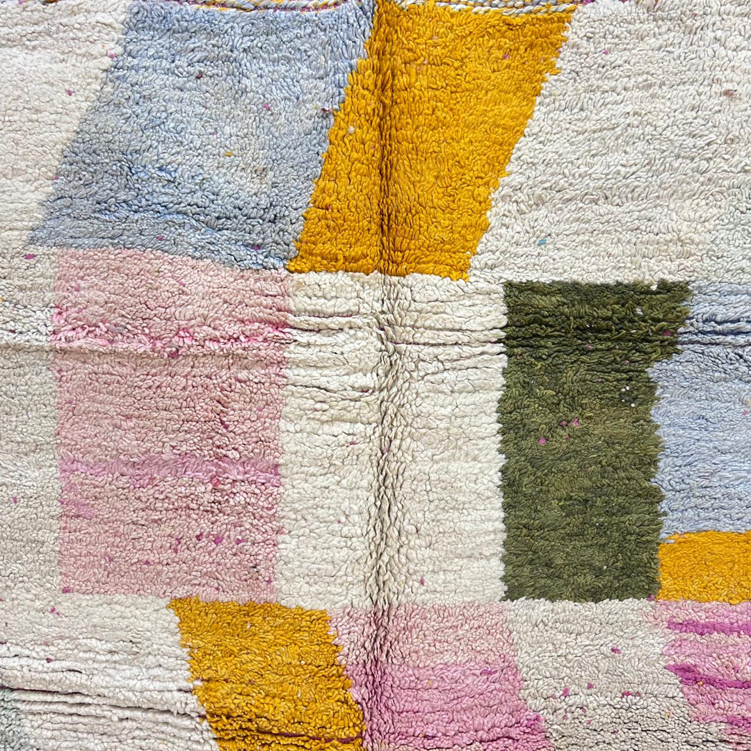 Vintage Moroccan wool rug with soft pastel geometric color-block design in ivory, pink, green, and mustard tones, handwoven by Berber artisans
