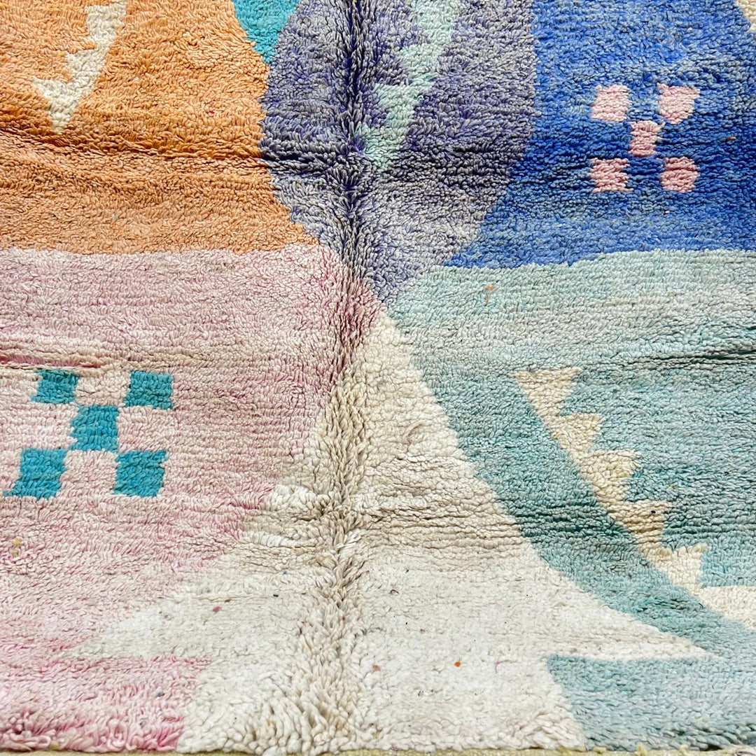Vintage Moroccan wool rug with colorful geometric Berber patchwork in orange, blue, mint green, lavender and ivory, handmade in Morocco.