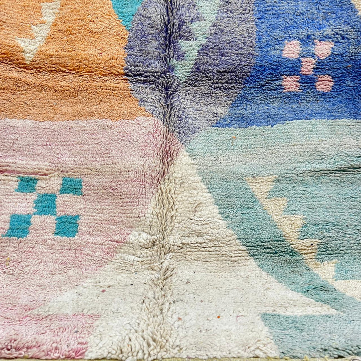 Vintage Moroccan wool rug with colorful geometric Berber patchwork in orange, blue, mint green, lavender and ivory, handmade in Morocco.