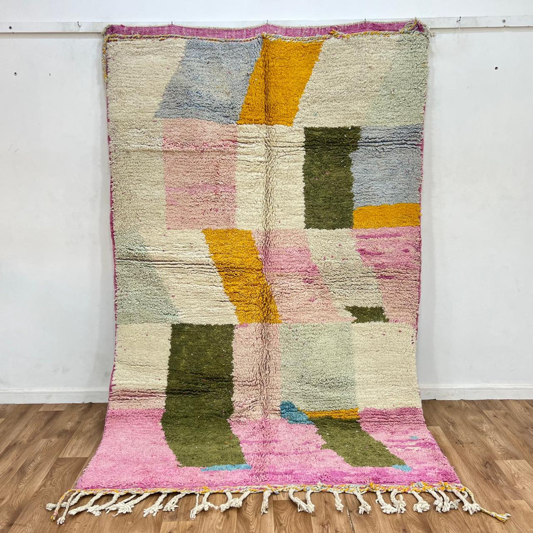 Vintage Moroccan wool rug with soft pastel geometric color-block design in ivory, pink, green, and mustard tones, handwoven by Berber artisans