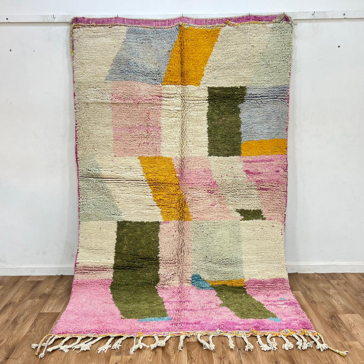 Vintage Moroccan wool rug with soft pastel geometric color-block design in ivory, pink, green, and mustard tones, handwoven by Berber artisans