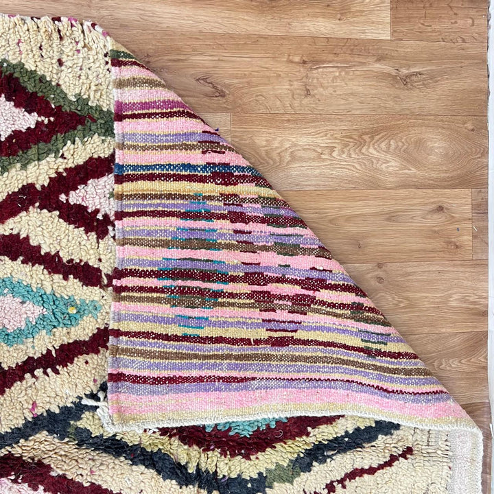 Vintage Moroccan diamond wool rug with tribal Berber pattern in ivory, burgundy, sage green and blush pink, handmade in Morocco.