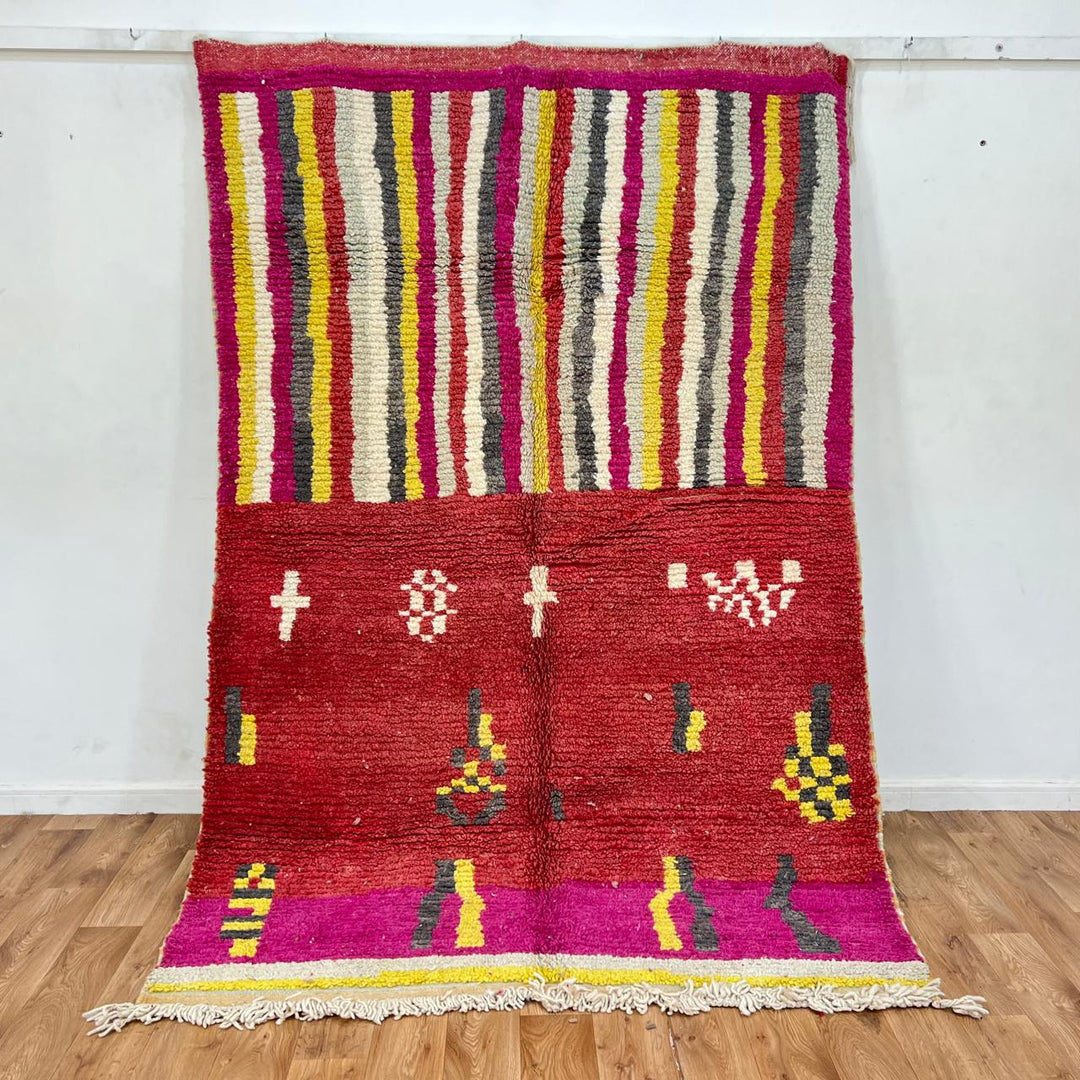 Vintage Moroccan striped wool rug with red pink yellow and gray Berber pattern, handmade in Morocco