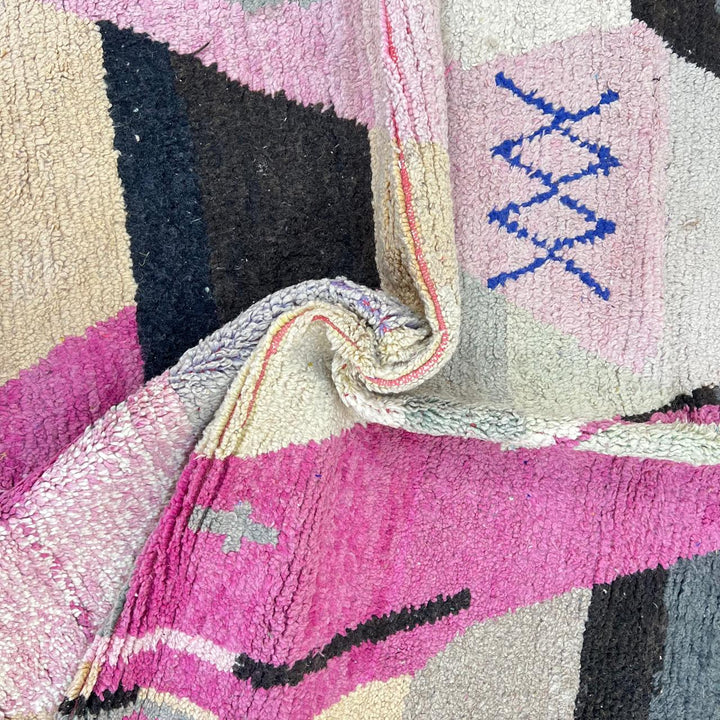 Vintage Moroccan wool rug with abstract geometric Berber design in blush pink, charcoal black, sage green and beige, handmade in Morocco.