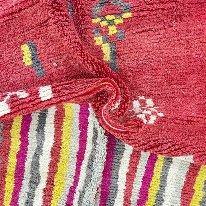Vintage Moroccan striped wool rug with red pink yellow and gray Berber pattern, handmade in Morocco